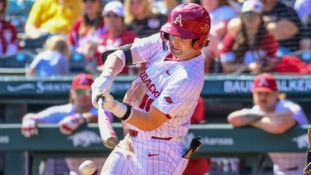 Razorbacks' Peyton Stovall hits pitch against Missouri
